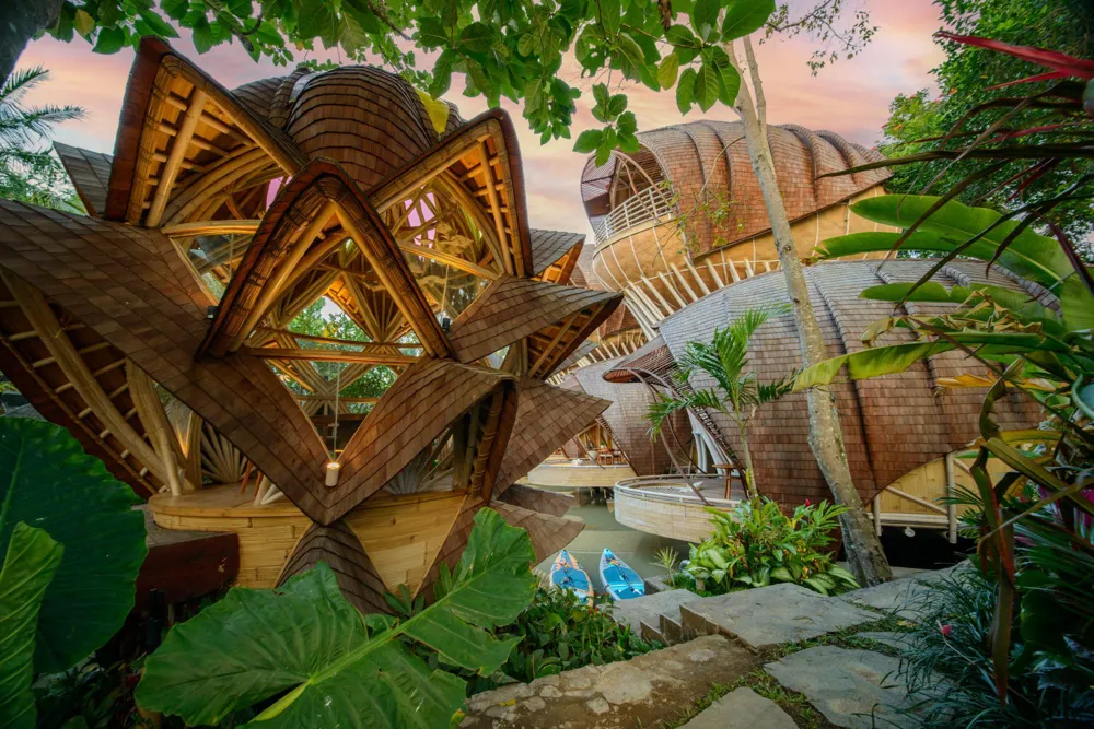 Organic bamboo architecture surrounded by tropical planting at Ulaman